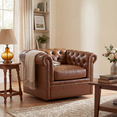 Fauteuil d'appoint pivotant touffeté avec structure en bois massif et garniture cloutée