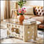 Table basse ovale de 98 cm (38,6 po) avec plateau en verre trempé caramel, piètement en bois sculpté ajouré, idéale pour une décoration moderne ou champêtre. Montage facile.