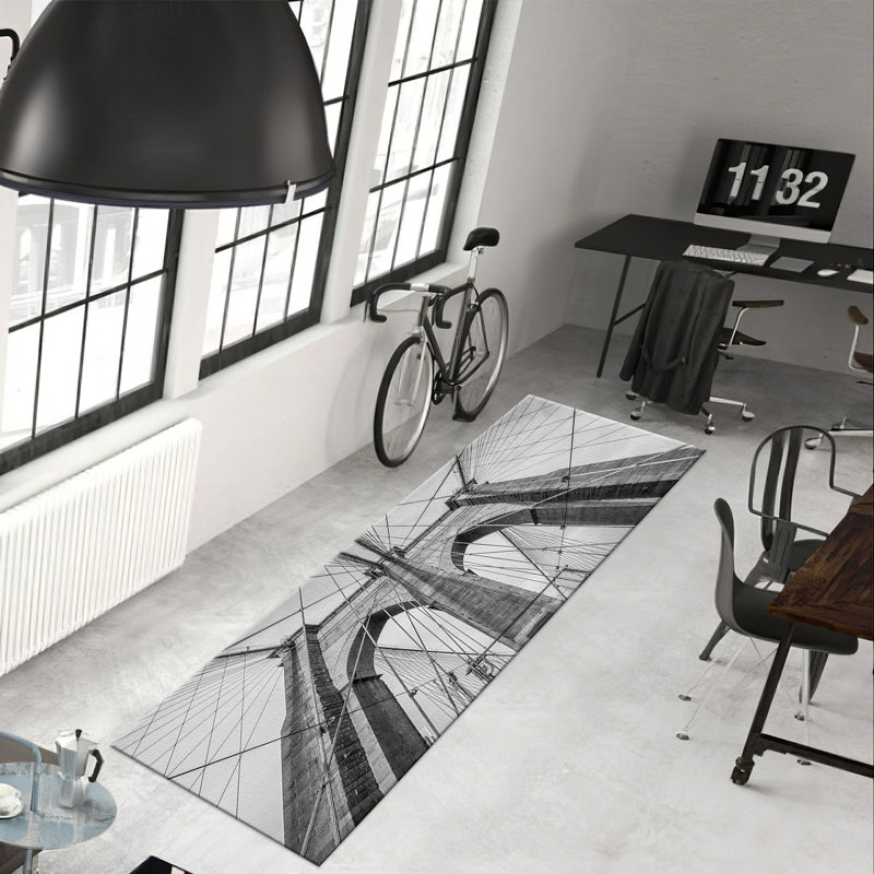 Tapis à motif géométrique moderne non tissé à motif mince avec un subtil agencement de gris et de blanc avec un motif en treillis complexe