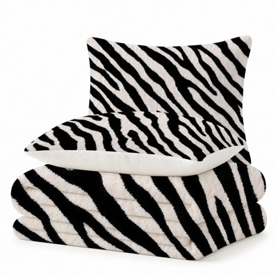 Ensemble de 3 pièces comprenant une couverture légère en flanelle de qualité supérieure et 2 taies d'oreiller à rayures zébrées noires et blanches contrastées, ultra-douce et chaude, idéale en toute saison. Couverture 152 x 203 cm + 2 taies d'oreiller anti-boulochage et lavables à la machine.