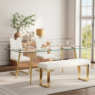 Ensemble de salle à manger en verre pour 4 à 6 personnes, de style moderne, comprenant une table de cuisine rectangulaire en verre, des chaises rembourrées en similicuir et un banc.