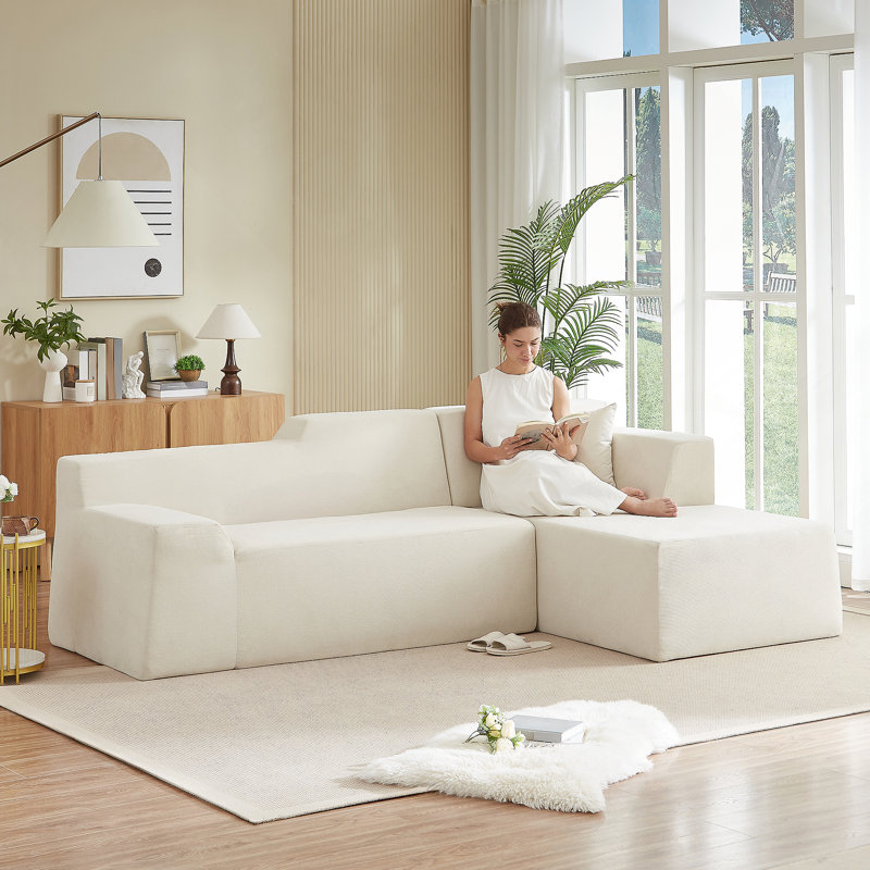 Canapé moderne à dossier haut en velours côtelé minimaliste moderne avec un confort amélioré et une conception peu encombrante.