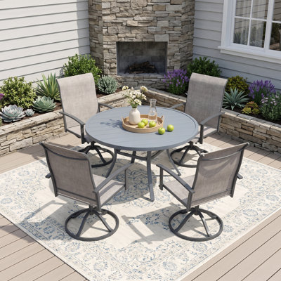 4-Person Outdoor Round Patio Dining Set With Swivel PVC-Coated Polyester Chairs