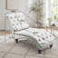 Fauteuil inclinable en velours capitonné