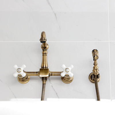 Kingston Brass Heritage Double-Handle 3-Hole Wall-Mount Bridge Kitchen Faucet with Brass Sprayer