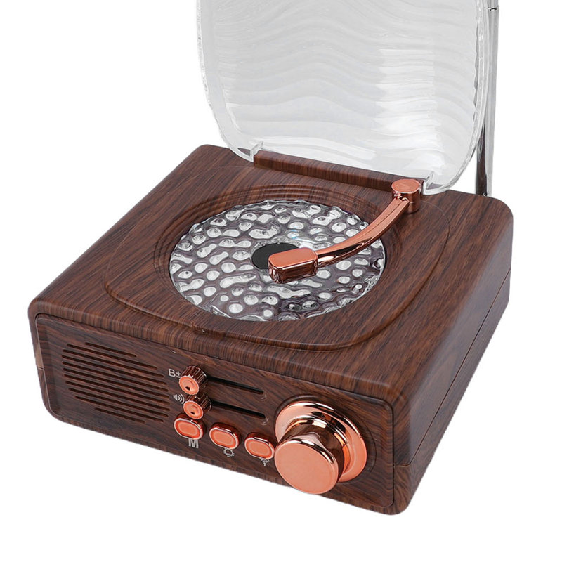 Lecteur de CD portatif avec haut-parleur Bluetooth, radio FM, ports USB et AUX, et veilleuse intégrée.