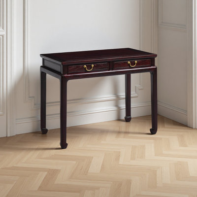 A rural-style bloodwood desk with drawers