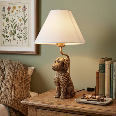 Lampe de table chiot en résine moderne avec abat-jour en tissu beige, finition or antique