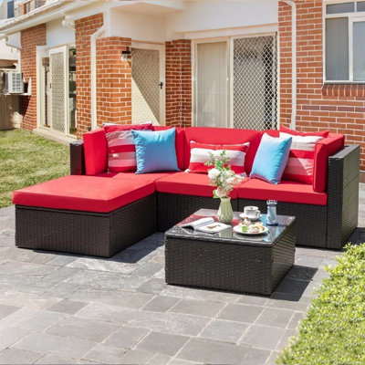 Ensemble de conversation modulaire en rotin 5 pièces avec canapé, coussins, coussins et table en verre
