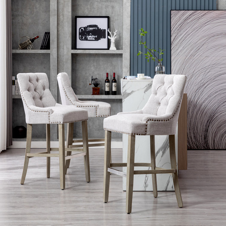 Amahri Upholstered Counter Stool with Solid Wood Frame