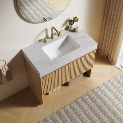 Meuble-lavabo FINO 36, sur pied, comptoir en pierre frittée gris Carrara veinée et lavabo en céramique avec 3 trous pré-percés pour robinetterie, démonté, robinetterie et bonde non inclus, couleur chêne Corolla