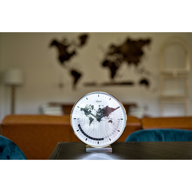 Nickel Plated Table Clock with a Quartz Time Only Movement   Dial features a world map and different time zones.