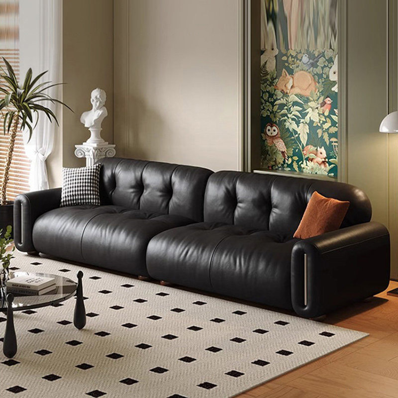 Causeuse-coussin modulable noire en cuir véritable