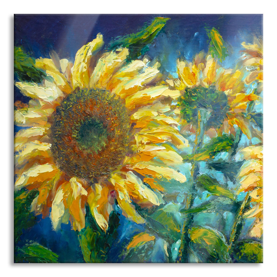 Glasbild Sonnenblumen vor blauem Hintergrund