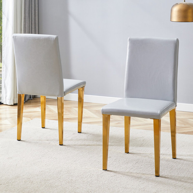 Deux chaises de salle à manger en polyuréthane gris clair, simples et polyvalentes, confortables et accompagnées. Des chaises de salle à manger exquises et polyvalentes offrent une nouvelle expérience confortable. (Ensemble de 2)