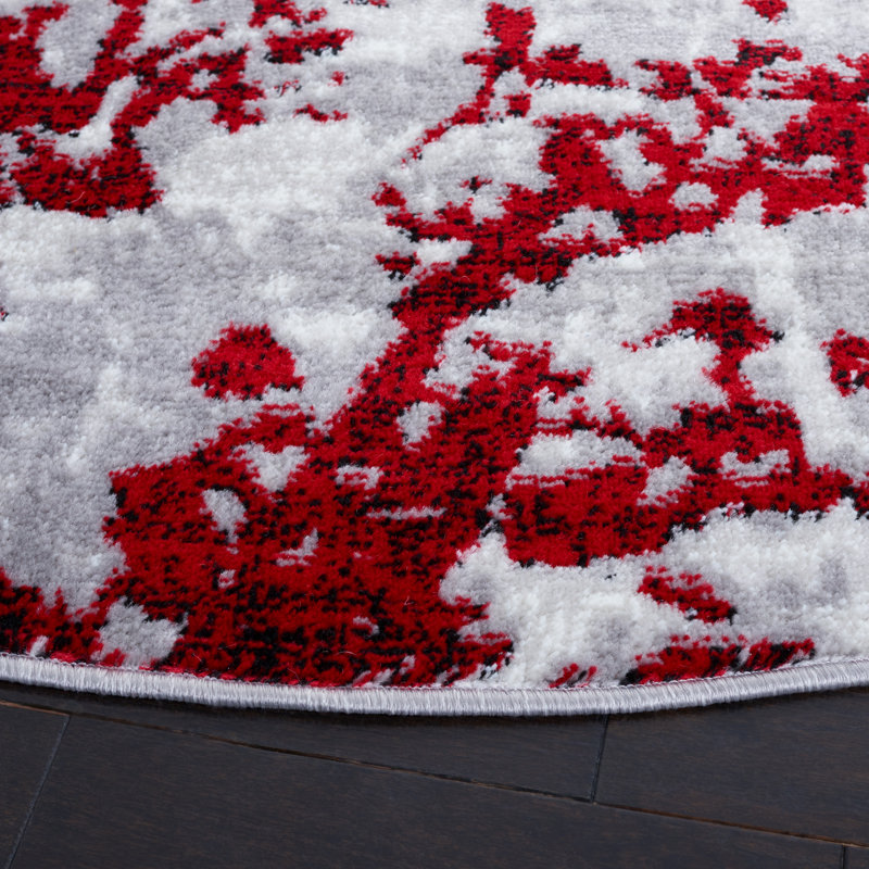 Tapis gris / rouge à motif abstrait, Rond 6 pi 7 po