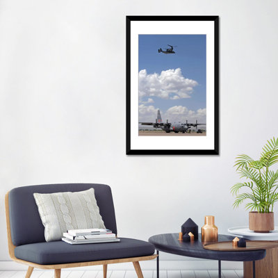 " A CV-22 Osprey Flies Over A C-130 Hercules " by Stocktrek Images
