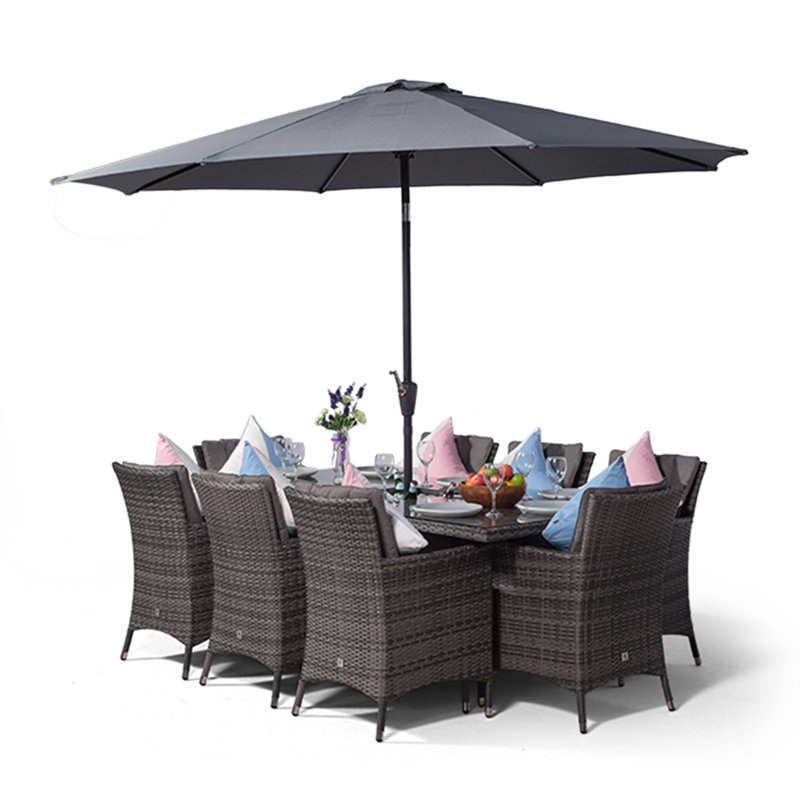 Karcher 8 - Person Wicker Patio Dining Set with Rectangular Table , Cushions Included, Grey