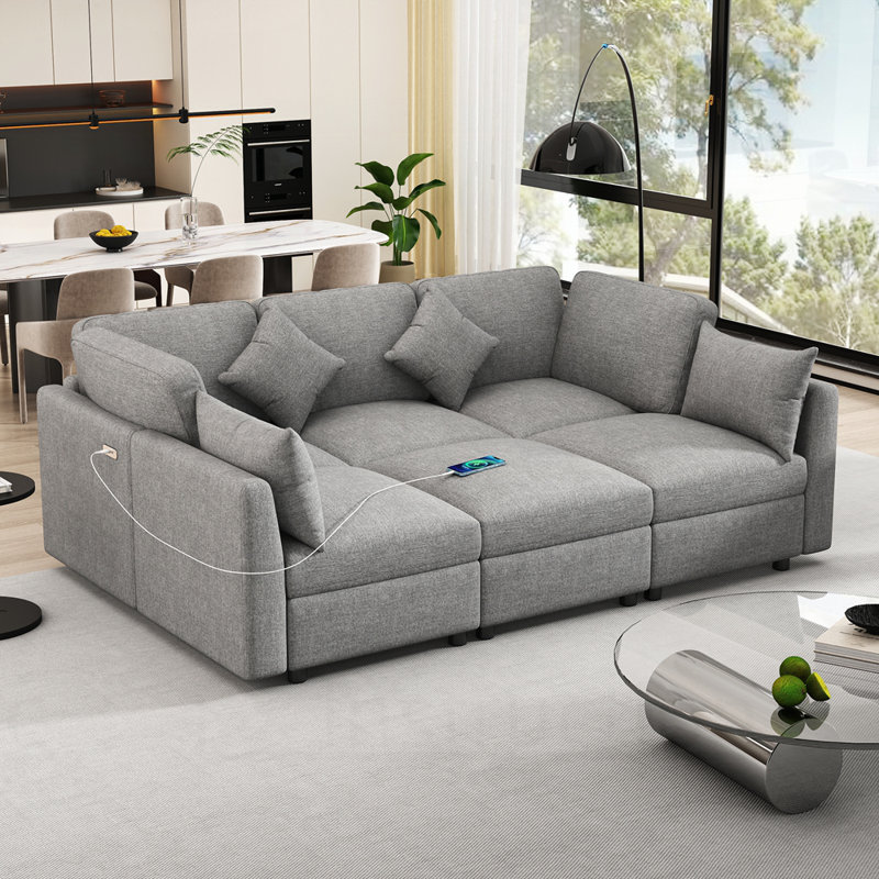 Canapé modulaire en forme de U avec ports USB pour repose-pieds mobile et coussins décoratifs pour un salon confortable et polyvalent