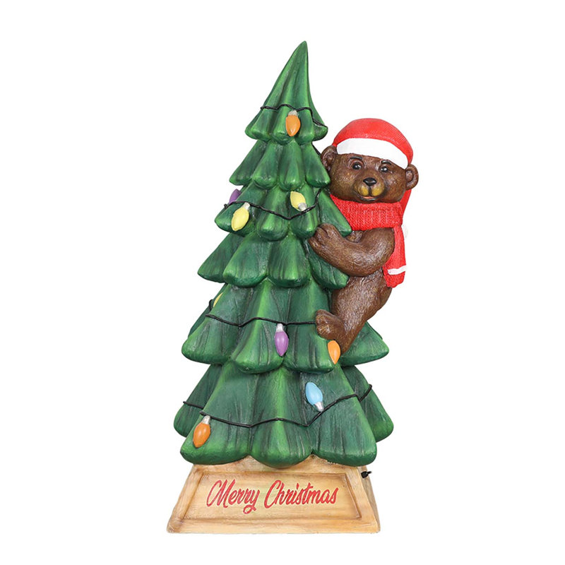 Ours sur un arbre de Noël