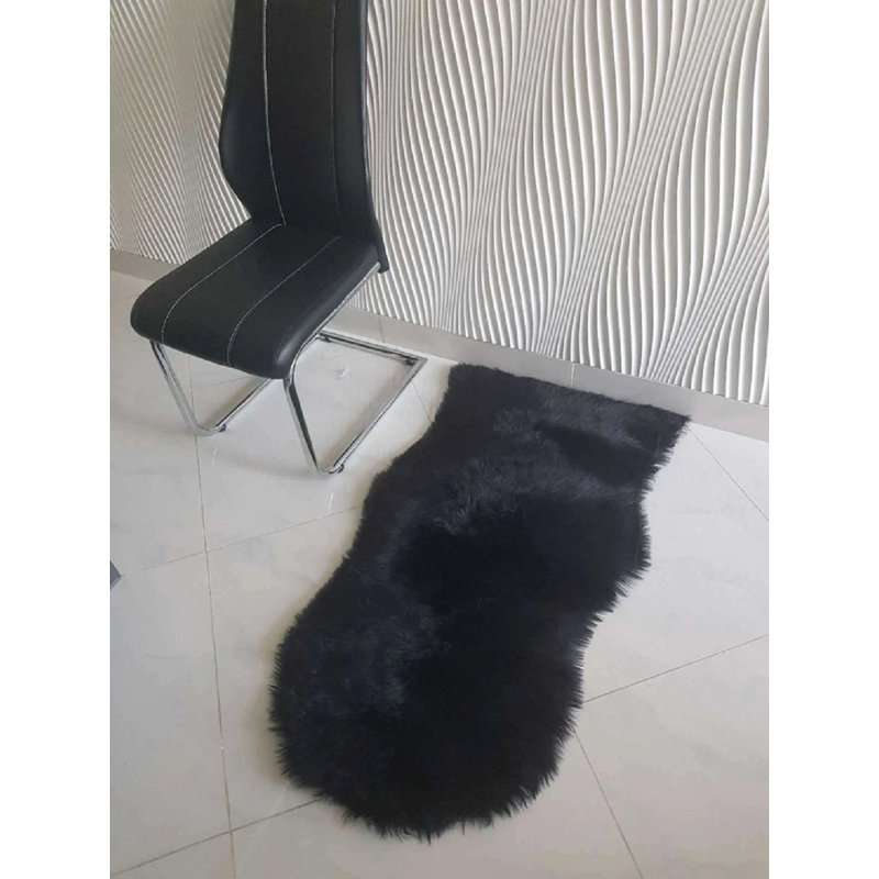 Oval Solid Colour Sheepskin 60cm X 110cm Area Rug, Black