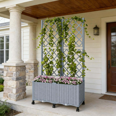 Boîte à fleurs mobile surélevée avec treillis et réservoir auto-arrosant pour un jardinage vertical sans effort.