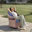 Chaise pivotante d'extérieur en osier avec dossier haut Courtyard-910834495