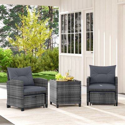 5 Piece Patio Rattan Furniture With 2 Ottomans & Tempered Glass Coffee Table by Hokku Designs
