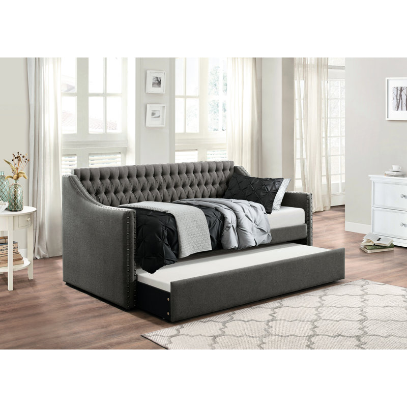 Canapé-lit moderne capitonné en tissu gris foncé de conception moderne avec lit gigogne et garniture cloutée