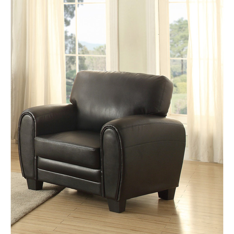 Chaise de salon noire en similicuir avec pieds exposés et fauteuil contemporain en bois massif