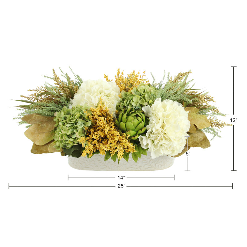 Assorted Hydrangea, Heather And Artichoke Centerpiece In Oval Cream Pot