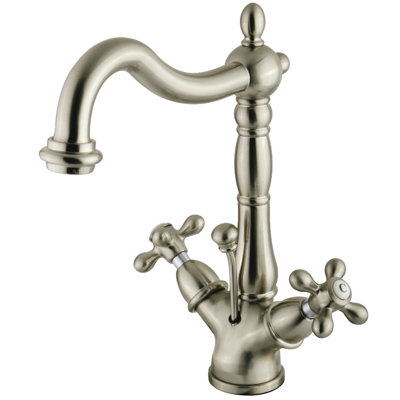 Kingston Brass Heritage Two-Handle 1-or-3 Hole Deck Mount Bathroom Faucet with Brass Pop-Up