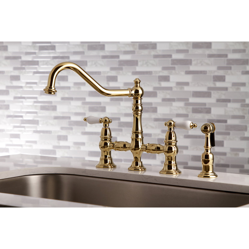 Kingston Brass Restoration Two-Handle 4-Hole Deck Mount Bridge Kitchen Faucet with Brass Side Sprayer, Polished Brass