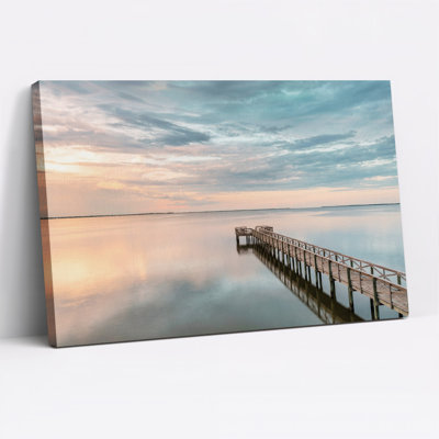 Wooden Pier Over Calm Water at Sunset Canvas Wall Art
