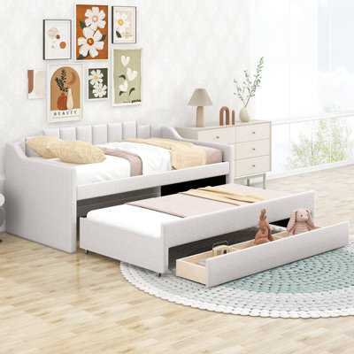 Lit de jour simple beige avec lit gigogne et tiroirs de rangement - Confortable et pratique pour une utilisation quotidienne.