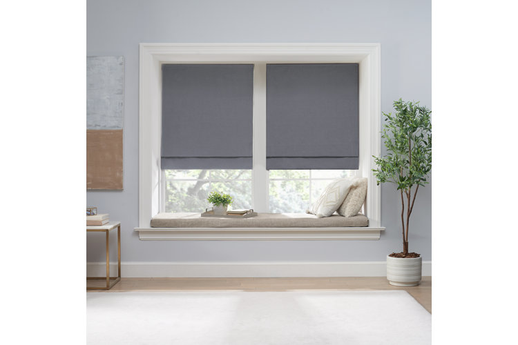 double gray roman shade on sitting window nook