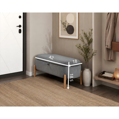 Banc de rangement en velours côtelé gris avec couvercle rembourré et capacité de rangement spacieuse; pieds en bois massif robustes; une unité polyvalente de siège et de rangement adaptée aux chambres à coucher ou aux entrées.