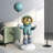 43.31"Balloon astronaut landing figurine-1376263693