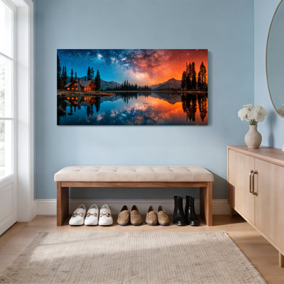 Ensemble de 1 tableau sur toile tendue représentant un chalet au bord d'un lac de montagne sous un ciel nocturne