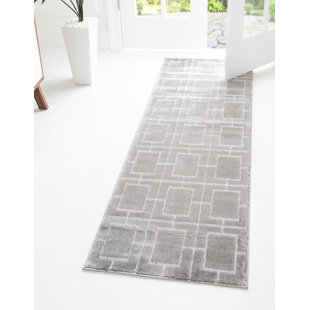 Tapis gris argenté à motif géométrique glam