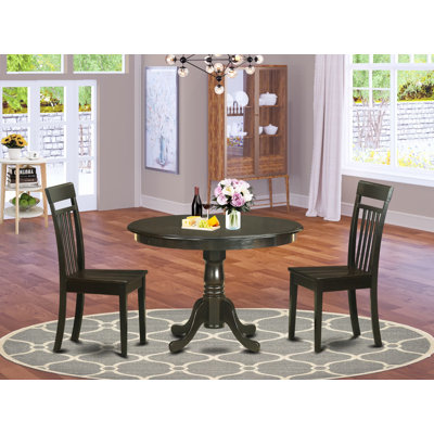 L'ensemble de salle à manger 3 pièces comprend une table de salle à manger ronde avec piédestal et 2 chaises de cuisine, cappuccino