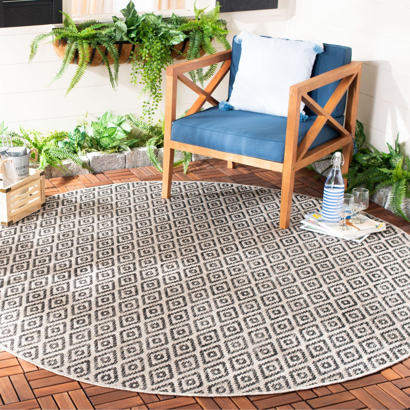 Arneshia Southwestern Navy Indoor/Outdoor Area Rug, Round 6'7"