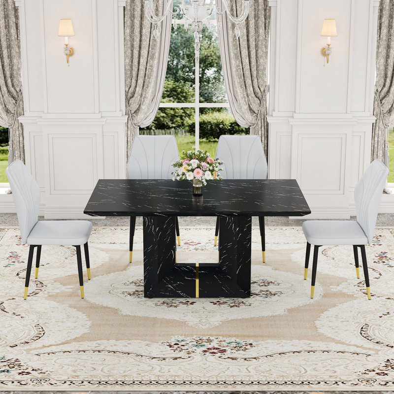 Ensemble de table et de chaises. Ensemble de salle à manger en panneau de fibres à densité moyenne à motif de marbre noir - 63 po x 35,4 po avec 4 chaises en polyuréthane avec un dossier élargi. Une sensation luxueuse.