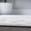 Tapis intérieur / extérieur carreauté à carreaux neutres ivoire Carruth-552412596