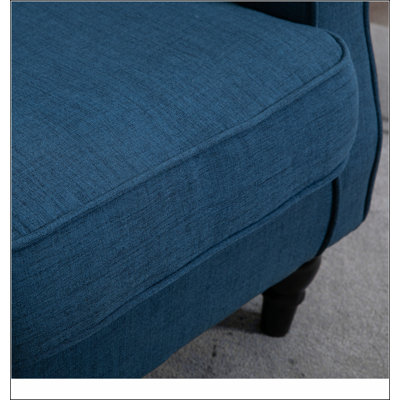 Fauteuil d'appoint capitonné à dossier haut
