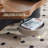 47.24 " Cloud-shaped Coffee Table 360° rotatable  microcrystalline stone tabletop, combined with a walnut wood set, forms a coffee table with storage functionality.