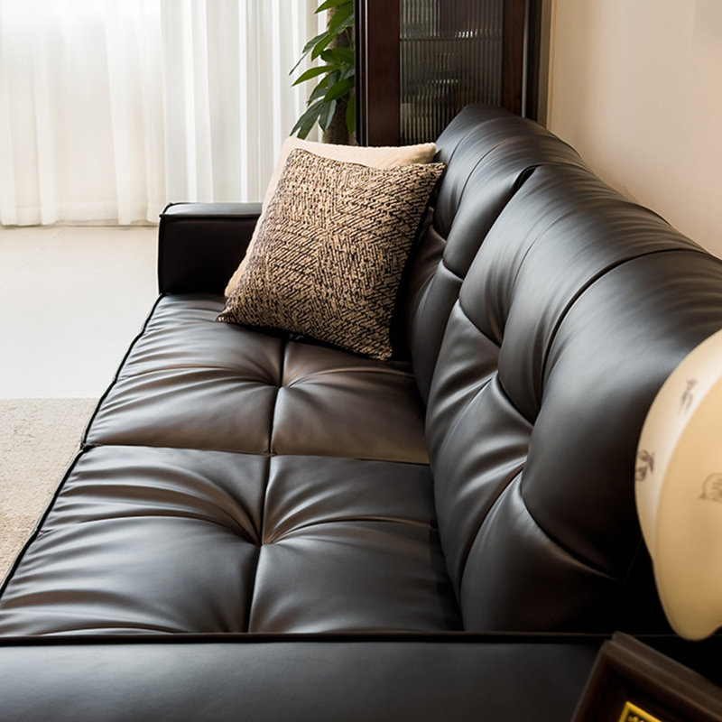 Causeuse-coussin modulable noire en cuir véritable