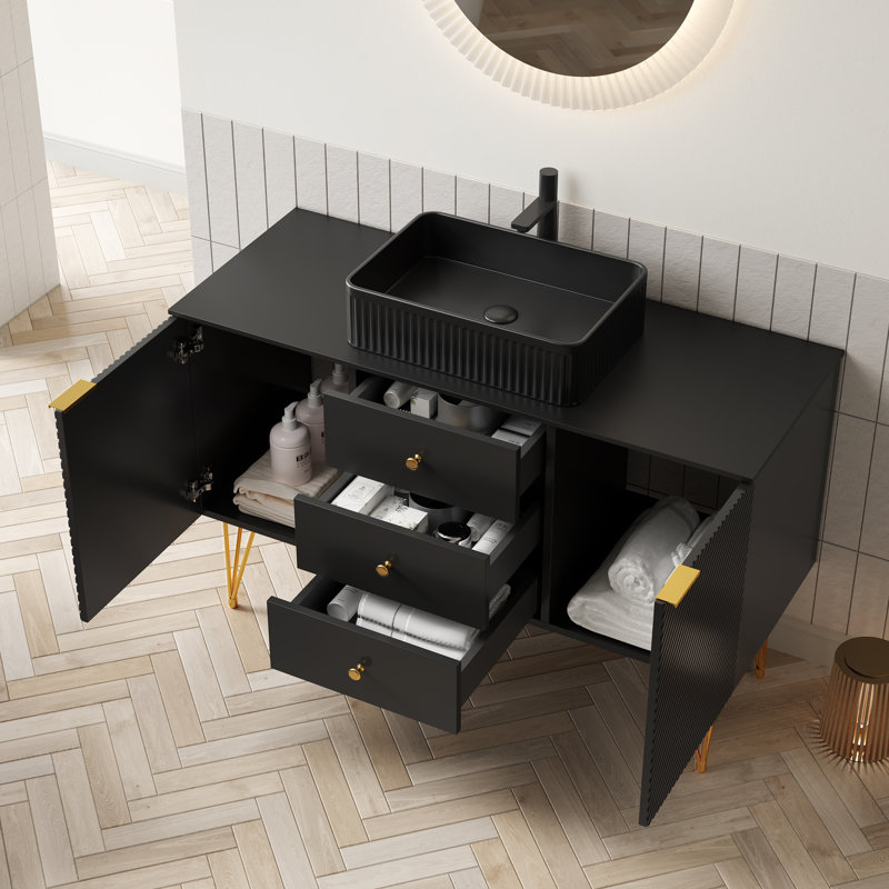 Luxueux meuble-lavabo noir et doré avec lavabo en céramique durable pour espaces élégants