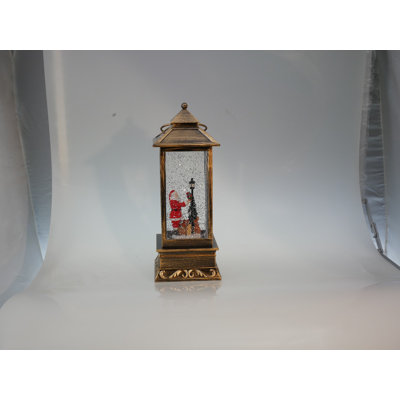 Lanterne avec globe scintillant orné d’animaux et d’un arbre de Noël