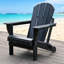 Chaise pliante noire en PEHD toutes saisons Adirondack avec finition semblable à du bois pour le patio extérieur-129910512